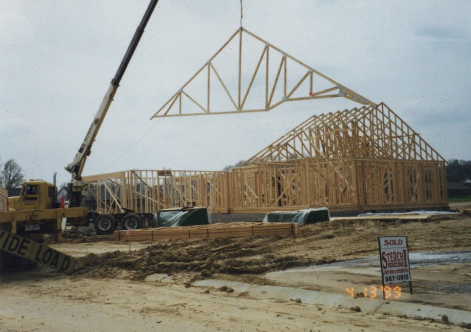 Sterchi Homes construction site in 1999 with a crane setting roof trusses