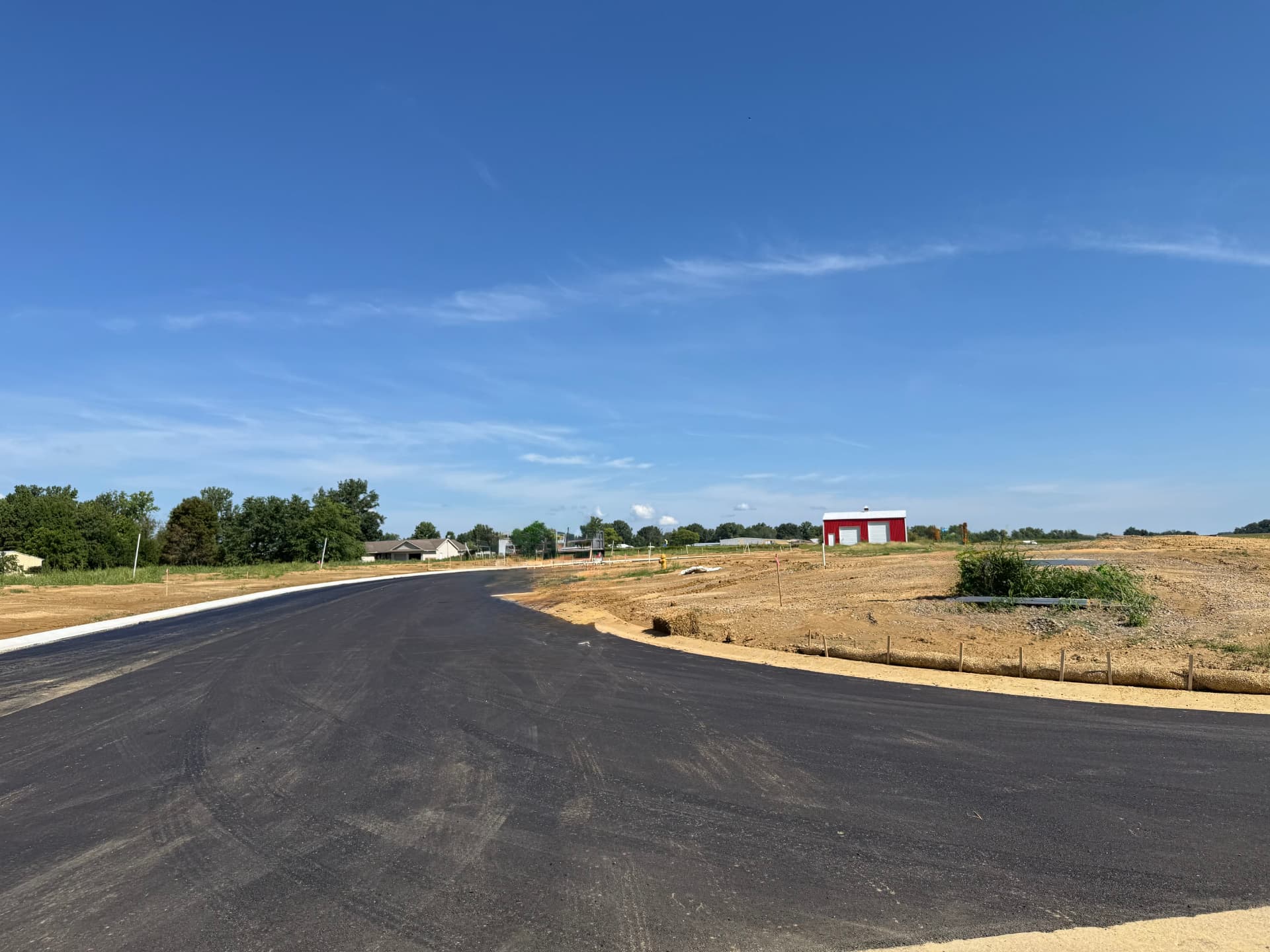 Paved street and developing homesites at Daylight Estates in Evansville, Indiana
