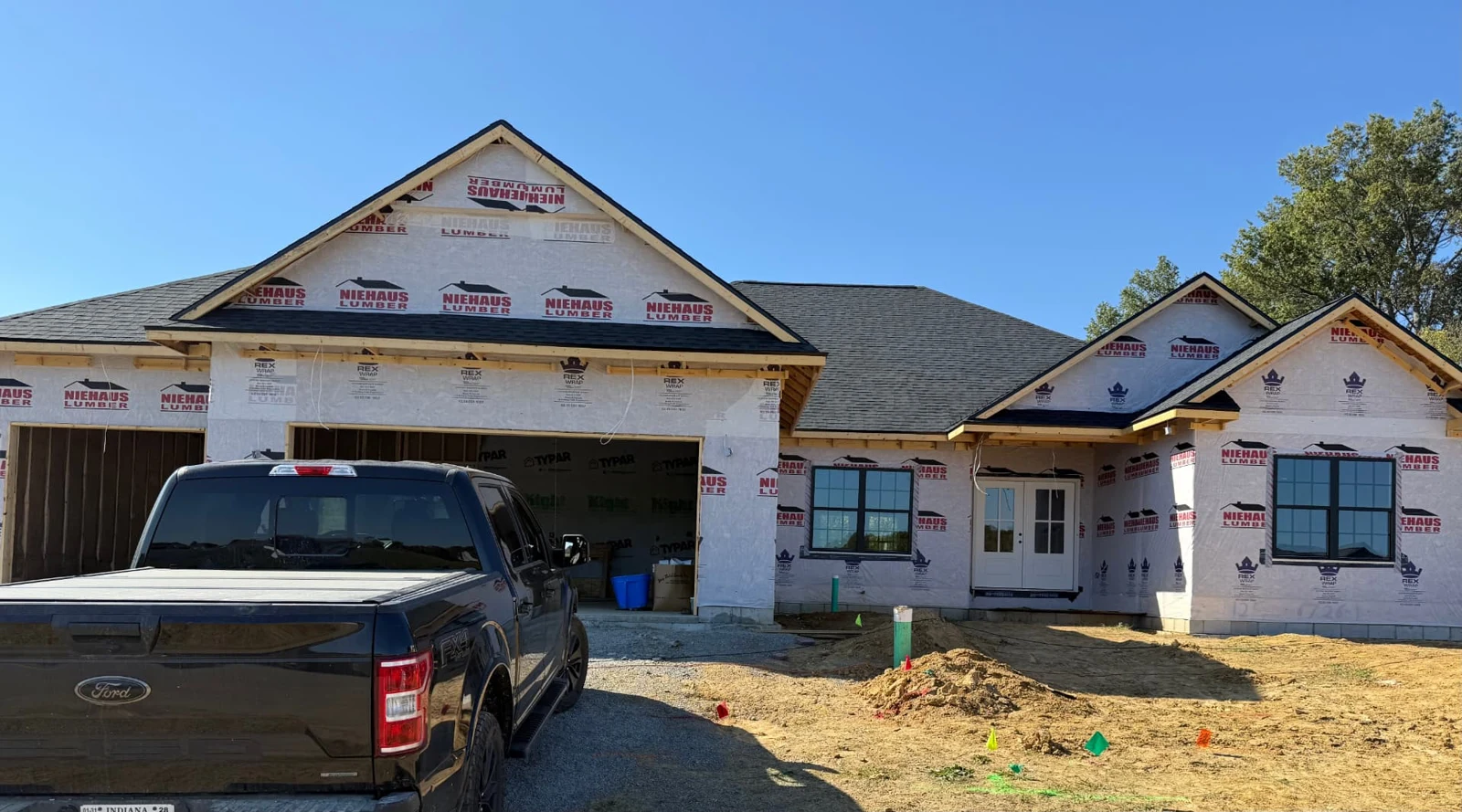 Black pickup truck parked outside a Sterchi home under construction in Southern Indiana.